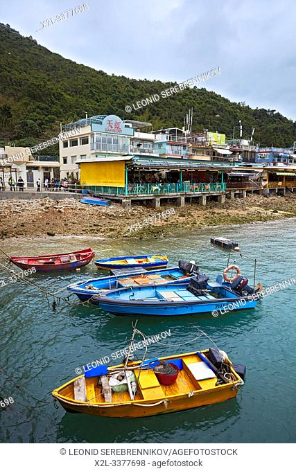 Colorful fishing boats moored at Sok Kwu Wan (Picnic Bay). Lamma Island, Hong Kong, China