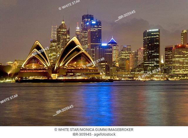 City view with Sydney Opera House at night, Port Jackson, Sydney Harbour, is the largest natural harbour in the world, Sydney, New South Wales, Australia