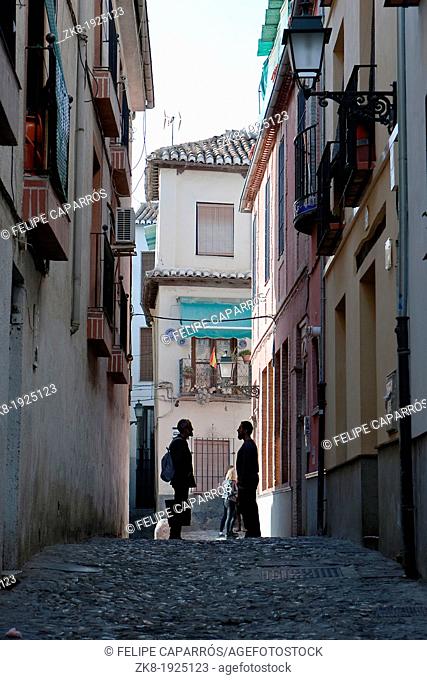 Two Moroccans speaking at the end of street in the Albaicín  Granada  Spain