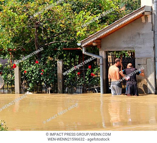 Heavy rains and and storms hit and tottaly flooded the town of Mizia north-east of the Bulgarian capital Sofia , Monday, Aug, 04, 2014