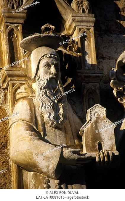 Franciscan monastery. Detail of statue/ figure with long eard. Holding model of church