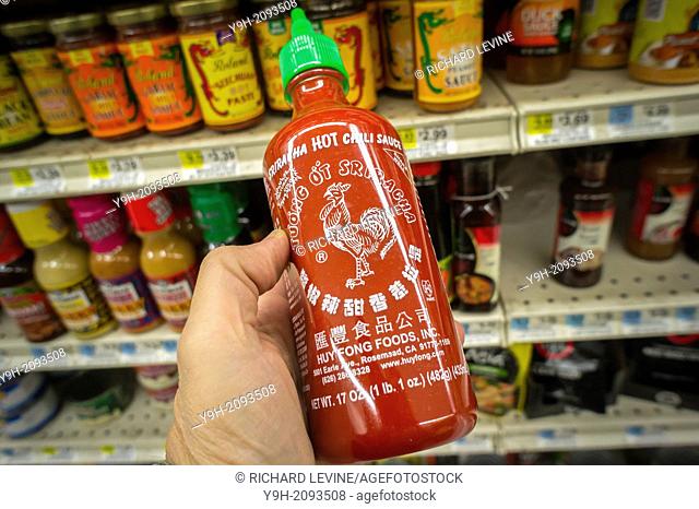 A bottle of Sriracha hot sauce manufactured by Huy Fong Foods is seen in the asian food section of a supermarket in New York