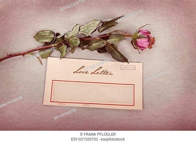 Liebesbrief im Vintage-Stil mit einer Rose