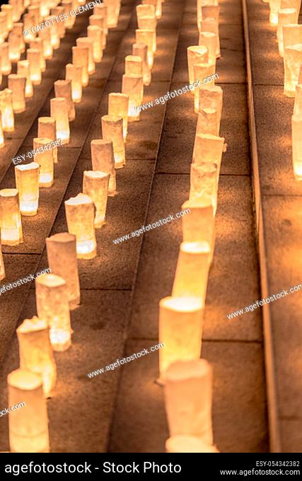 Handmade japanese washi paper lanterns illuminating the stone steps of the Zojoji temple near the Tokyo Tower during Tanabata Day on July 7th