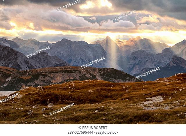 Mountains Panorama of the Dolomites at Sunrise with clouds.Italy