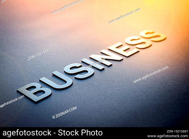 Word business written with white solid letters on a board