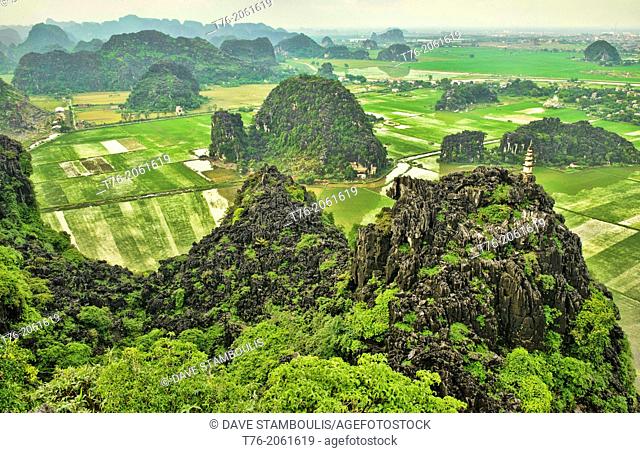 Vietnam. Beautiful limestone karst mountains in Ninh Binh. Image taken from the top of Hang Mua Temple which overlooks the Tam Coc river area as well as all the...