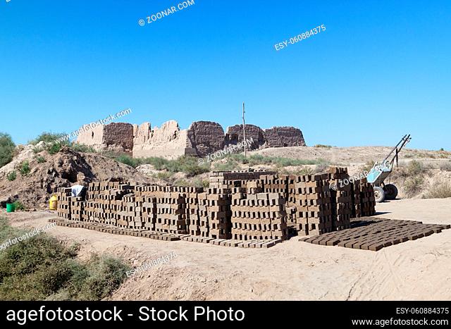 repair of ancient fortress Kyzyl-kala in Kyzylkum Desert, Uzbekistan