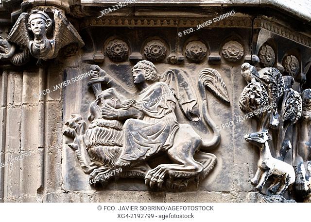 Spain, Catalonia, Barcelona, Cathedral, Relief in Sant Iu Portal, man (probably Samson) killing a lion