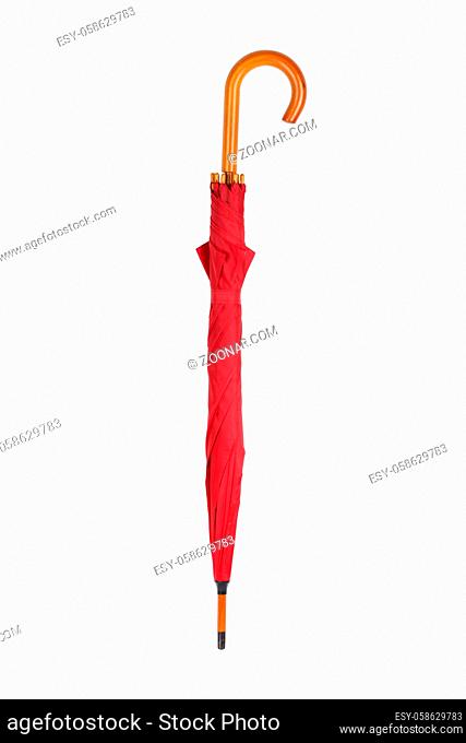A closed red umbrella isolated on white with clipping path