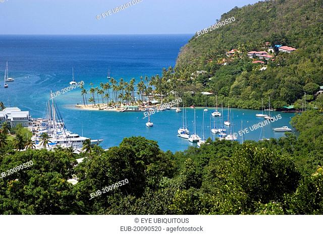 Marigot Bay The harbour with yachts at anchor the and lush surrounding valley