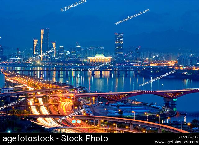 Aerial view of Seoul downtown cityscape and Seongsan bridge over Han River in twilight. Seoul, South Korea