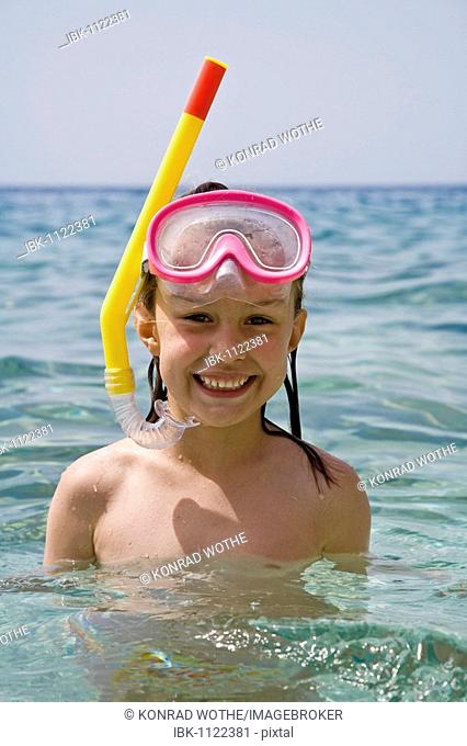 Girl with diving goggles and a snorkel, 6 years old, Hvar Island, Dalmatia, Croatia, Europe