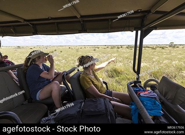 mother and daughter in safari vehicle