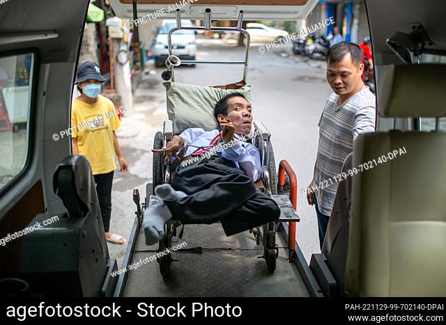 PRODUCTION - 06 October 2022, Vietnam, Hanoi: Dinh Quoc Tuan has cerebral palsy and needs a special transporter with a motorized ramp to travel long distances...