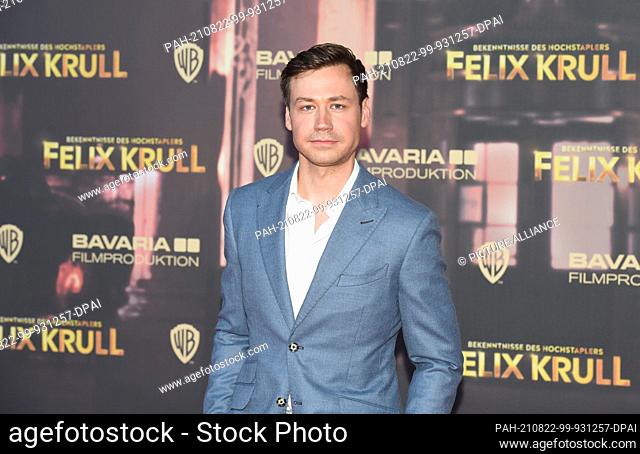 22 August 2021, Bavaria, Munich: Actor David Kross stands on the red carpet at the premiere of the film ""Confessions of Felix Krull"" at the ARRI cinema