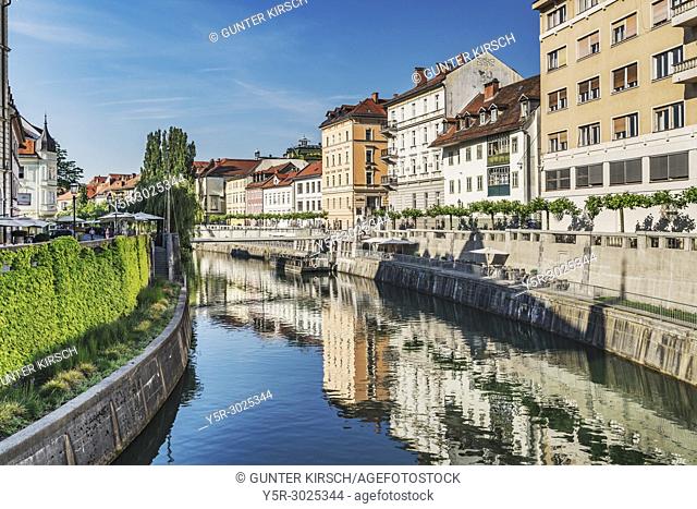 View over the river Ljubljanica to the promenade and to the historic houses of the old town of Ljubljana, Slovenia, Europe