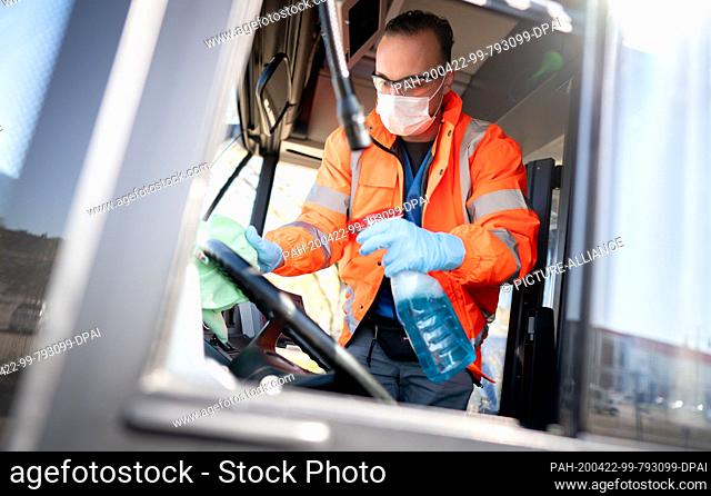 22 April 2020, Berlin: An employee cleans the driver's cab of a BVG bus at the terminal stop Kurt-Schumacher-Platz. Teams of two to three employees clean up to...