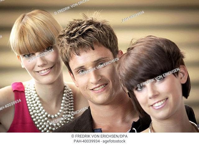 The models Ramona (R), Tim and Vanessa present the new haircut trends 'Aufgesetzter Bob' ('Bob put on top') (L-R), 'Mr Spock' and 'Dr Bob' at the fair 'Hair and...