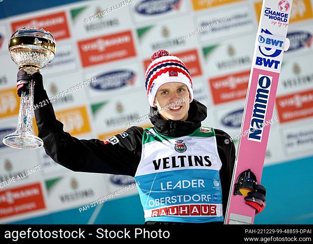 29 December 2022, Bavaria, Oberstdorf: Nordic skiing/ski jumping: World Cup, Four Hills Tournament, large hill, men, award ceremony