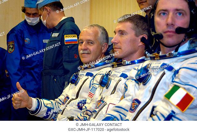 Cosmonaut Sergei K. Krikalev (center), Expedition 11 commander representing Russia's Federal Space Agency; astronaut John L