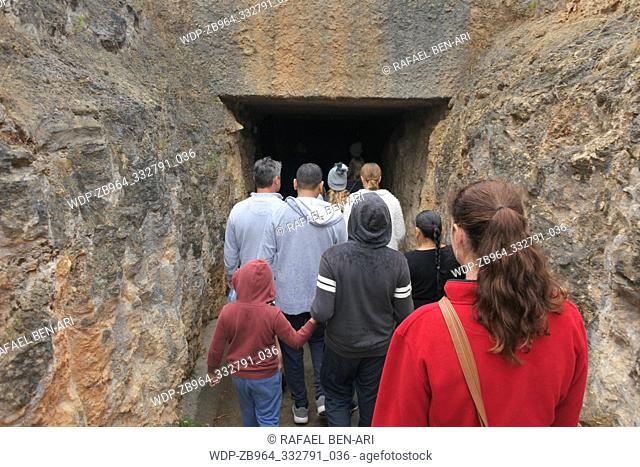 NARACOOTE, SA - APR 22 2019:Tourist entering Victoria Fossil Cave in Naracoorte Caves National Park, Know for its extensive fossil record when the site was...