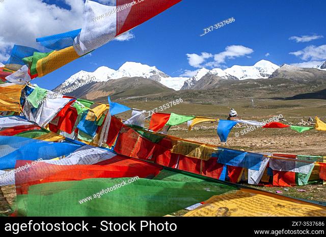 La Ken La pass or Laken pass at 5190 metres on the road to remote Nam Tso Lake Tibet. Namtso Lake Tibet China. Prayer flags next to the base of Mount Nyenchen...