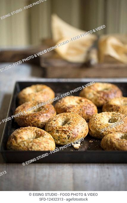 Homemade bagels on a baking tray