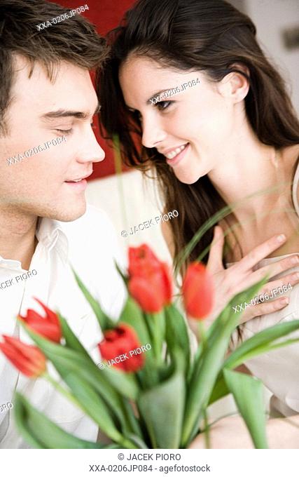 portrait of couple with red tulips
