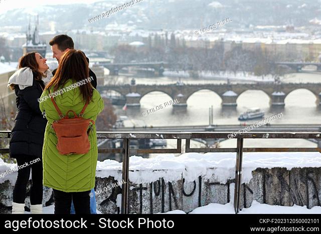 Young people take photos in view point to River Vltava with bridges in Prague Letna, Czech Republic, December 3, 2023. (CTK Photo/Milos Ruml)