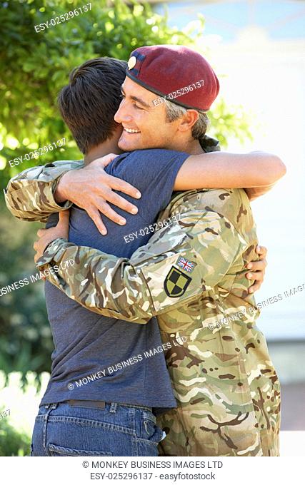 Soldier Returning Home And Greeted By Teenage Son
