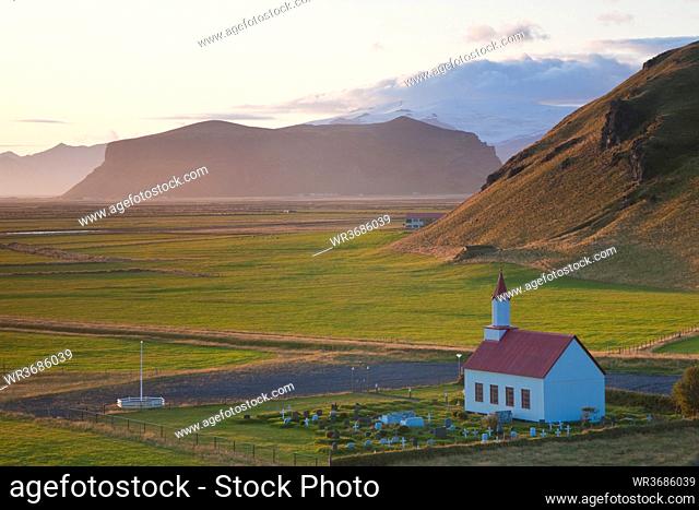 Small traditional white church near Vik, in a valley