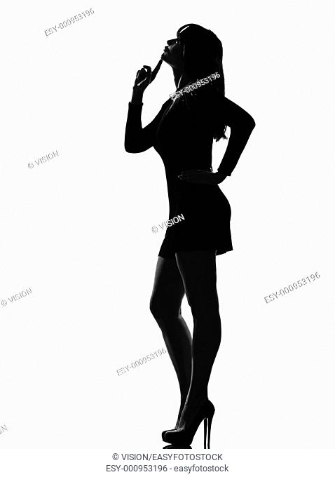 stylish silhouette caucasian beautiful woman thinking pensive looking up full length thinking pensive on studio isolated white background