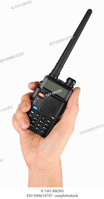 Portable radio transceiver in hand, isolated on white background