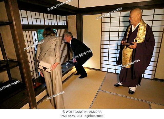German President Joachim Gauck and his partner Daniela Schadt visit the Ginkaku-ji temple and are given a tour from priest Raitei Arima (R) in Kyoto,  Japan