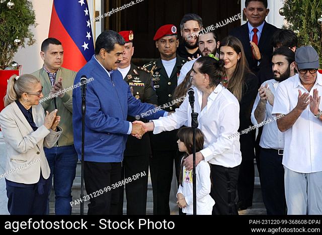 20 December 2023, Venezuela, Caracas: Nicolás Maduro (3rd from left), President of Venezuela, greets Alex Saab (4th from right), Colombian businessman