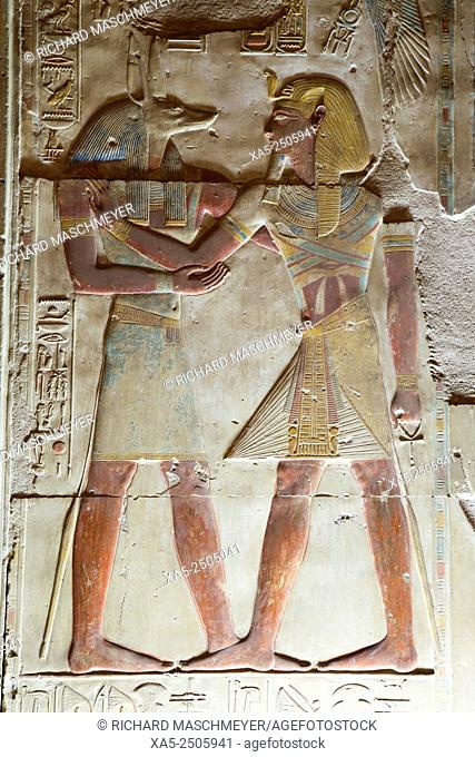 Bas-relief of the God Anubi (left), Pharaoh Seti I (right), Temple of Seti I, Abydos, Egypt