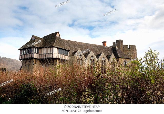 Side view of Stokesay castle in Shropshire surrounded by hedge