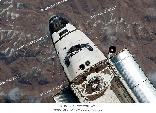 This view of the cabin and forward cargo bay of the space shuttle Discovery was provided by an Expedition 23 crew member during a survey of the departing...