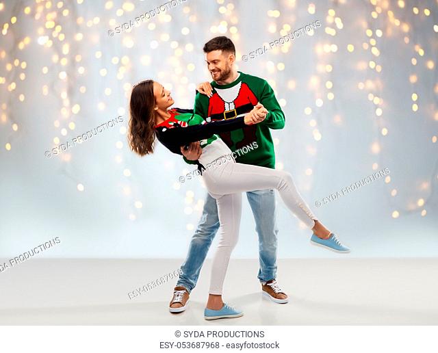 couple dancing at christmas ugly sweater party