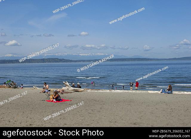 People on the beach at Alki Beach in West Seattle, Washington State, USA