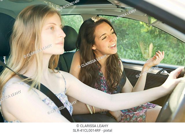 Teenage girls driving car