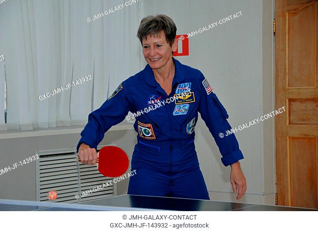 At her Cosmonaut Hotel crew quarters in Baikonur, Kazakhstan, Expedition 50-51 crewmember Peggy Whitson of NASA tries her hand at a game of ping-pong Nov