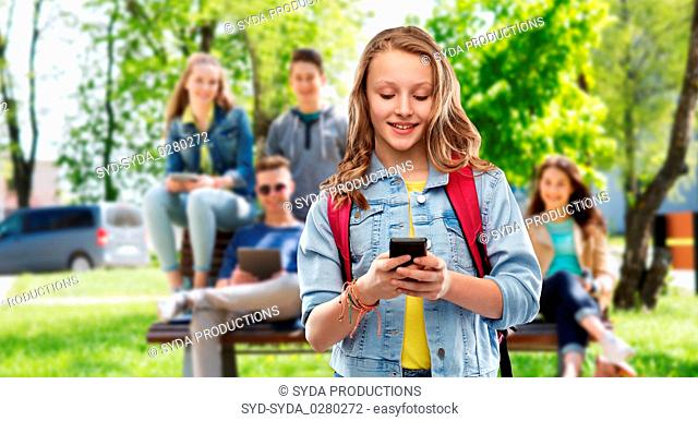 teen student girl with school bag and smartphone