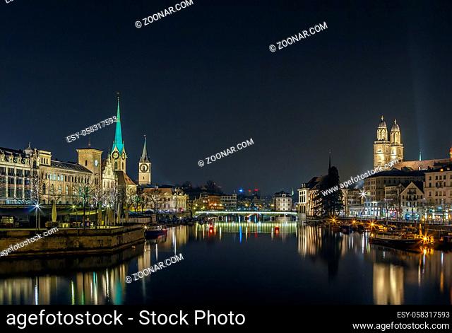 Limmat river with view of churchs in Zurich in evening, Switzerland