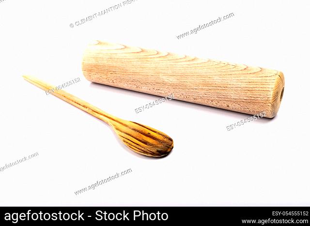 wooden spoon and rolling pin on white background in studio
