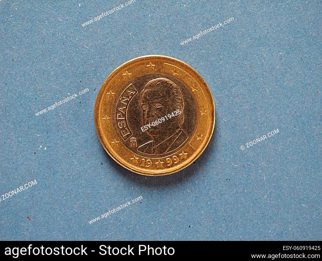 1 euro coin money (EUR), currency of European Union, Spain over blue background