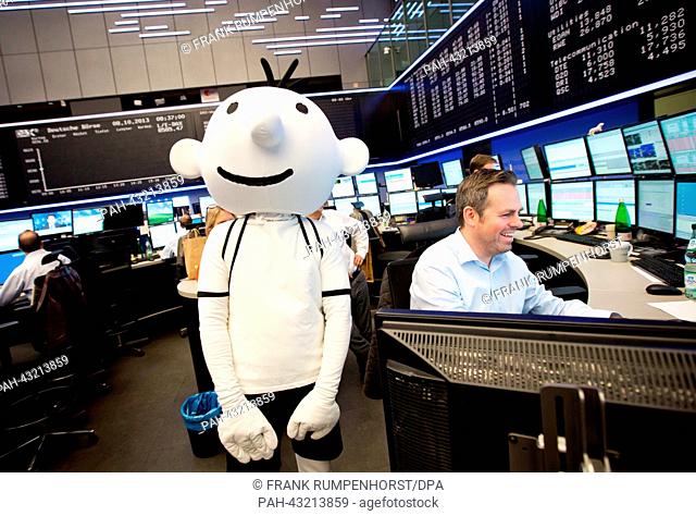 An actor dressed as the main protagonist of the book series 'Diary of a wimpy Kid', Gregory 'Greg' Heffley, is pictured at the stock exchange shortly before the...
