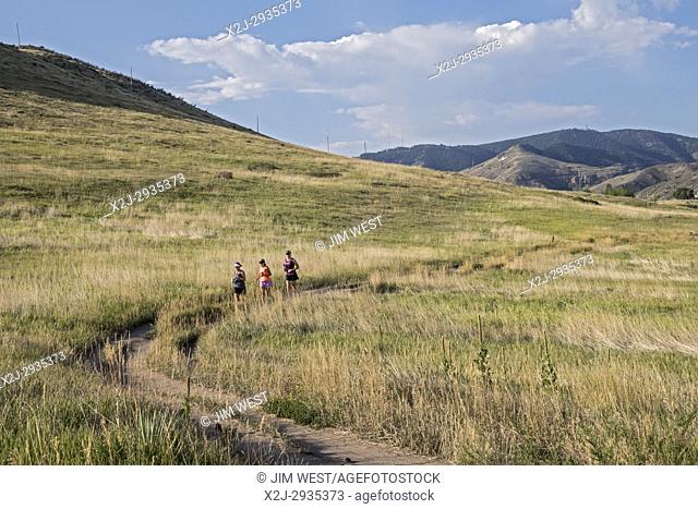 Golden, Colorado - Runners in North Table Mountain Park, a mesa overlooking Denver
