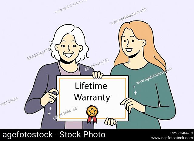 Smiling caregiver with elderly patient holding lifetime warranty food good quality service. Happy mature woman with guarantee assurance certificate in hands